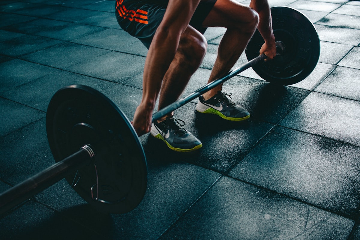 Sleep-themed photo: gym weights — a Sleep, Finally guide to leg day and sleep why hard sessions make you sleepy