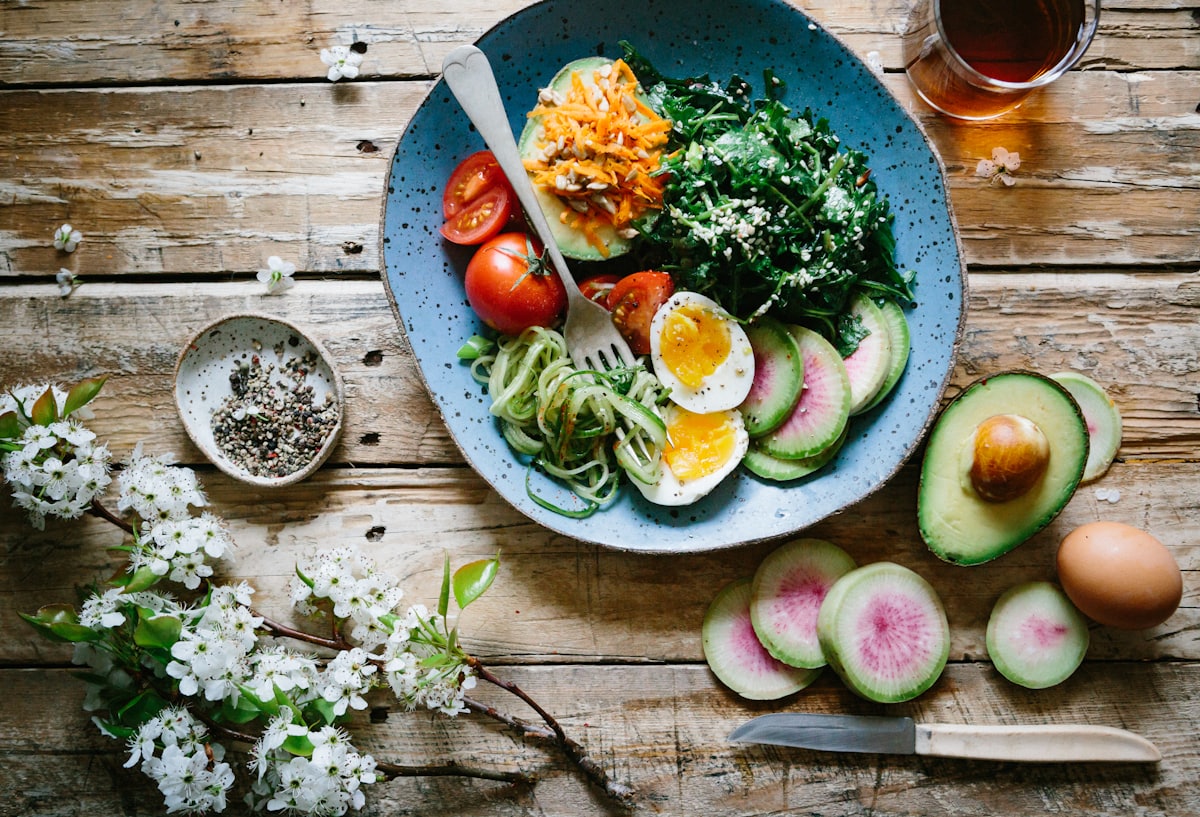 healthy food on table - a Sleep, Finally guide to Social Jet Lag and Your Metabolism