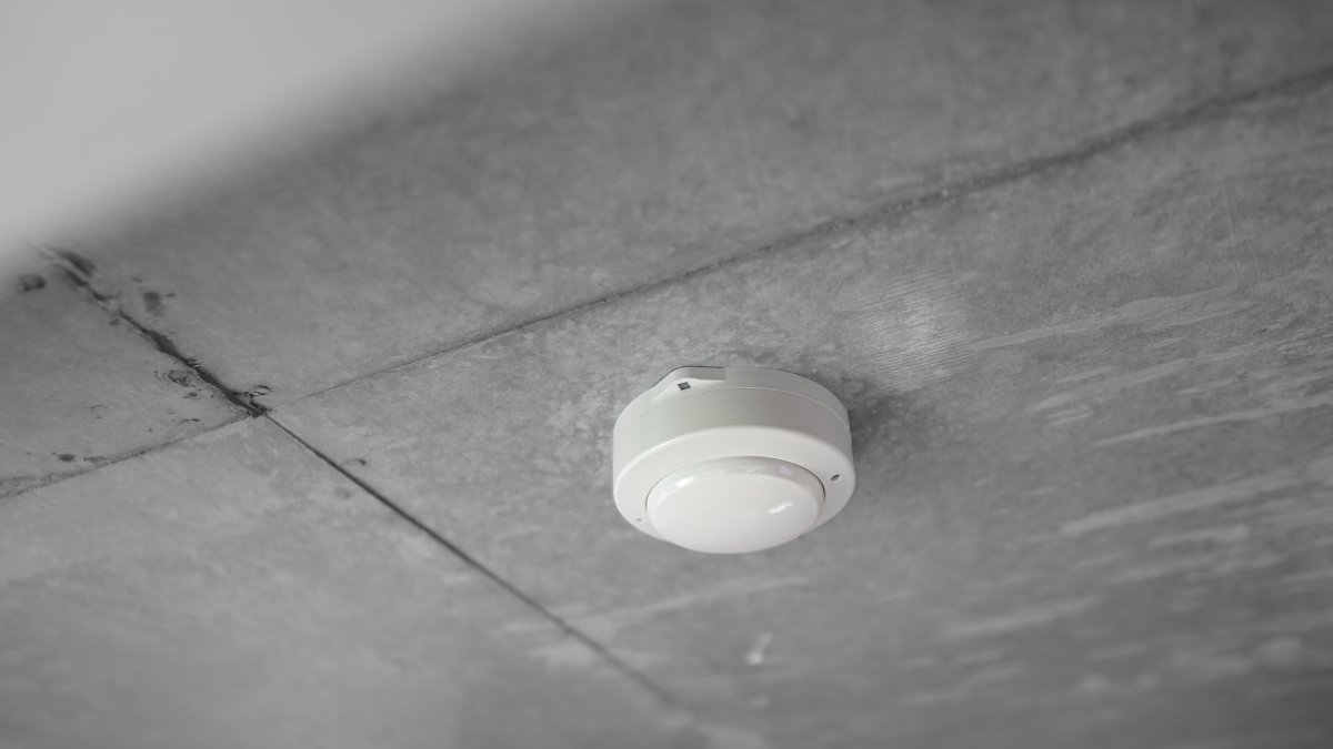 A light bulb on a table. — a Sleep Finally guide to The Smoke Alarm That Never Resets: Chronic Stress 101.