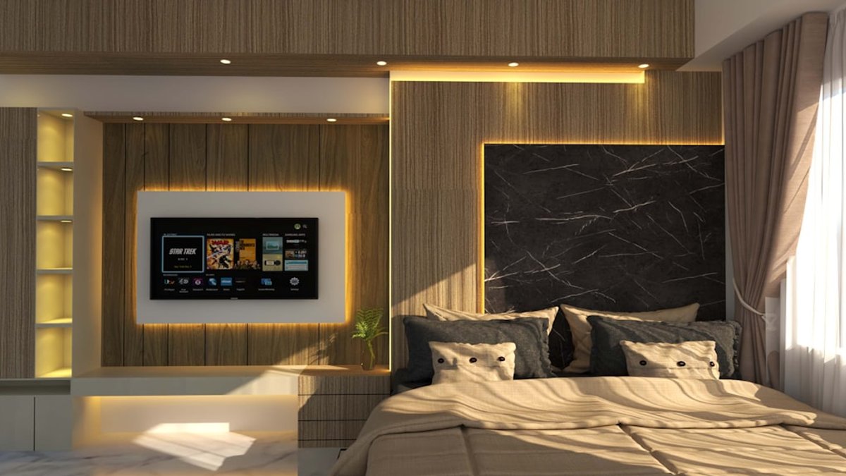 A luxurious bedroom with a TV and bed. — a Sleep Finally guide to TV in the Bedroom: Keep It or Move It Out.