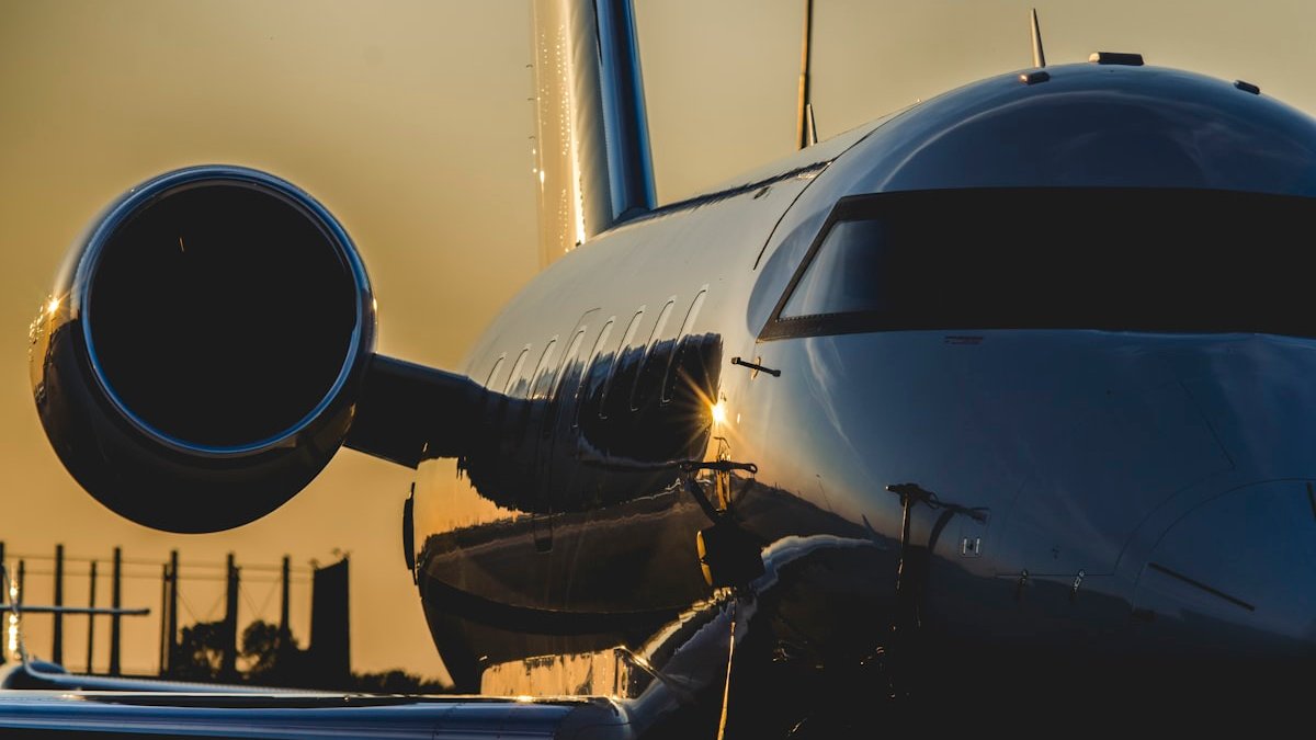 Airplane during golden hour. — a Sleep Finally guide to What Causes Social Jet Lag.