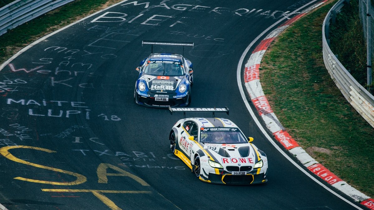 Two running cars on race track. — a Sleep Finally guide to What Happens in CBT-I for Racing Minds.