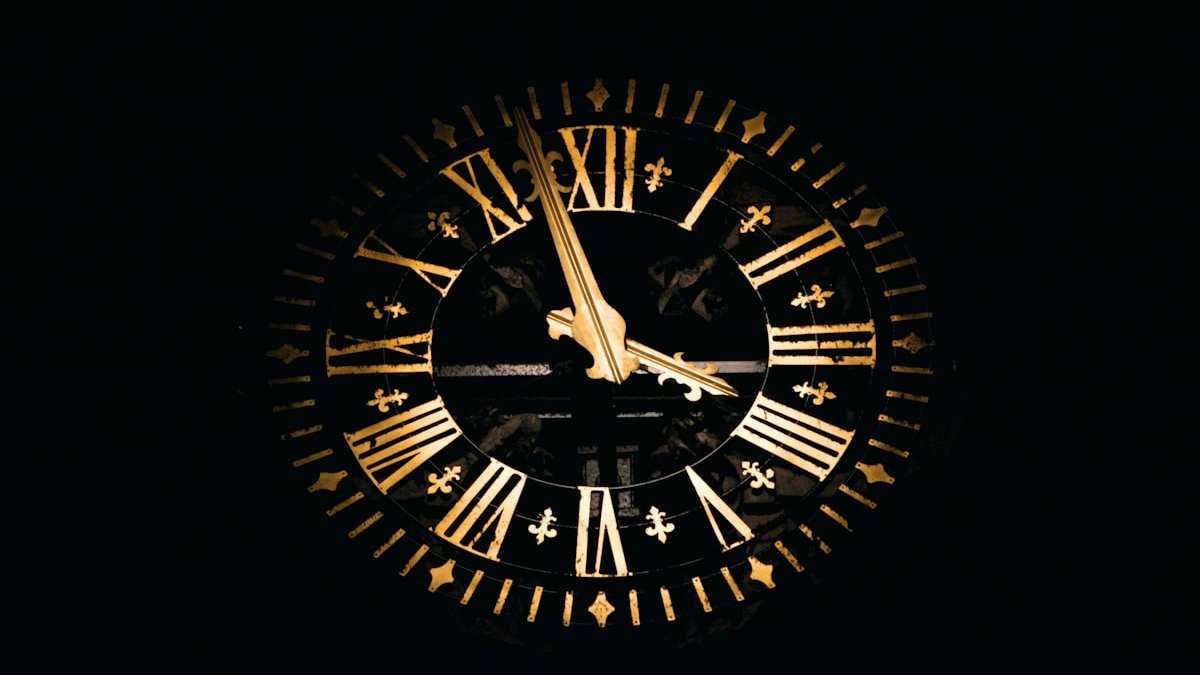 Round black and brown analog clock. — a Sleep Finally guide to Why an Analog Clock Beats Your Phone at Night.