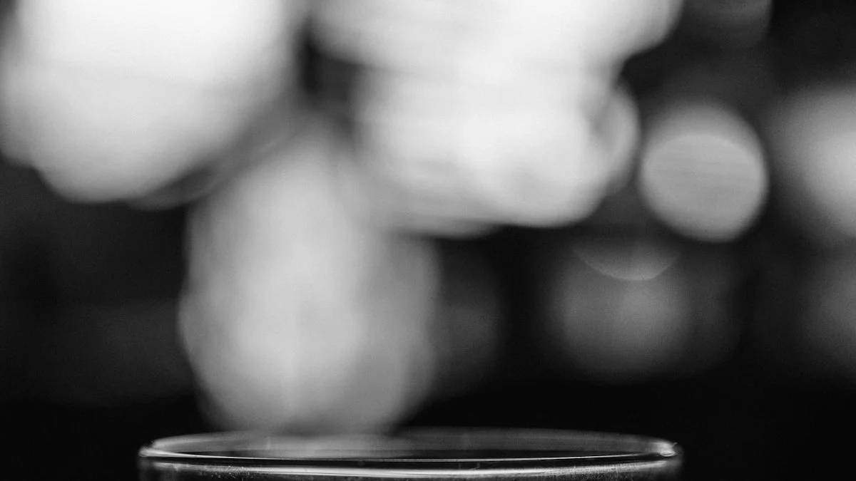 grayscale photo of a drinking glass with water — a Sleep, Finally guide to Why Do I Wake Up at 3am After Drinking?