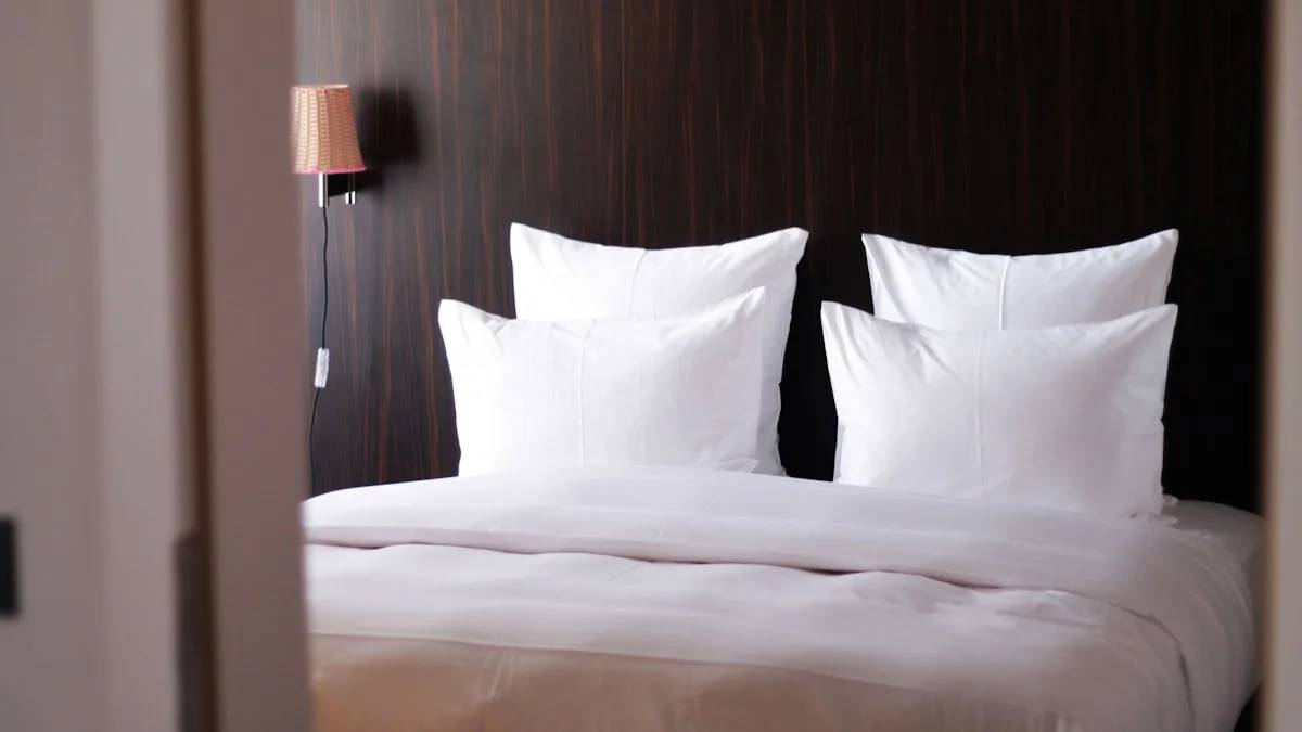 white bed pillow on white bed — a Sleep, Finally guide to Why Hotel Beds Feel Better Than Yours