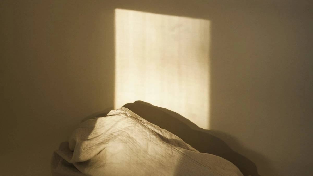 window shadow on wall — a Sleep, Finally guide to Why Sleeping In on Weekends Makes Mondays Worse