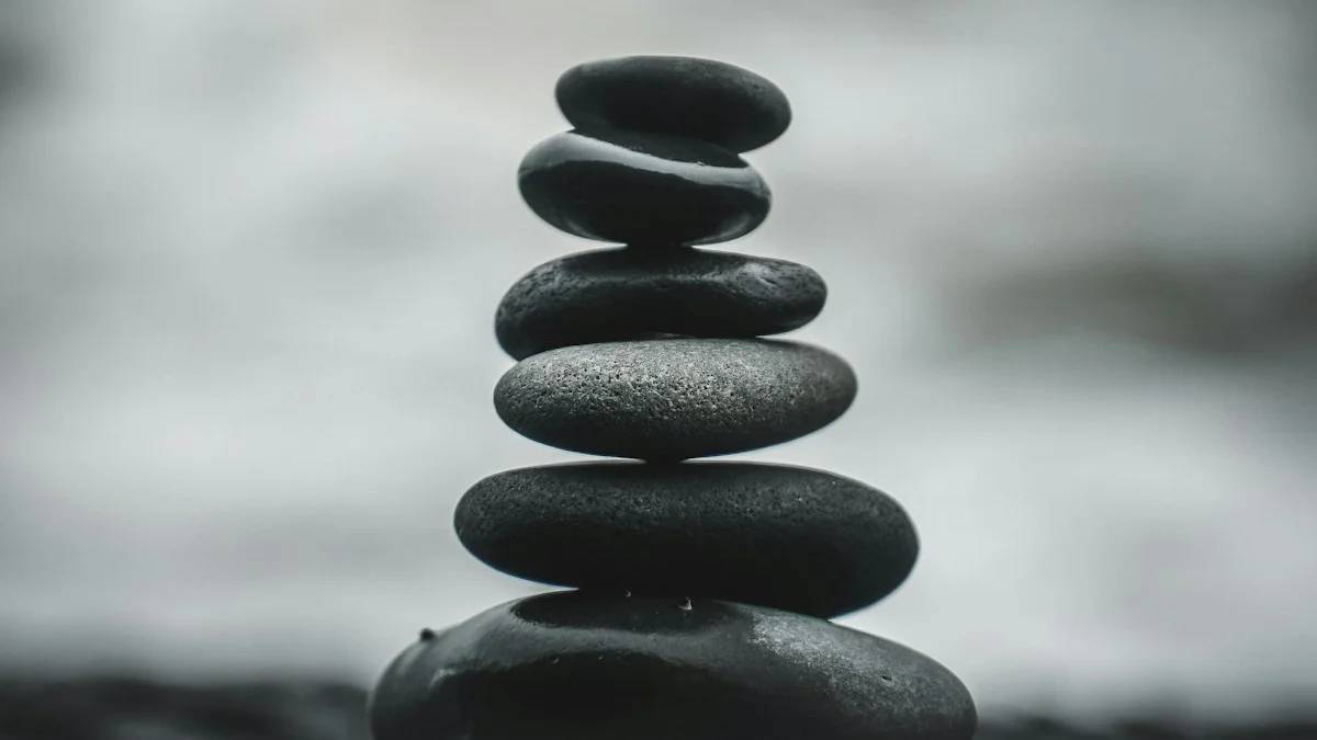 selective focus photography of pile of decorative stones — a Sleep, Finally guide to Why Small Stresses Ruin Sleep (It's the Compounding)