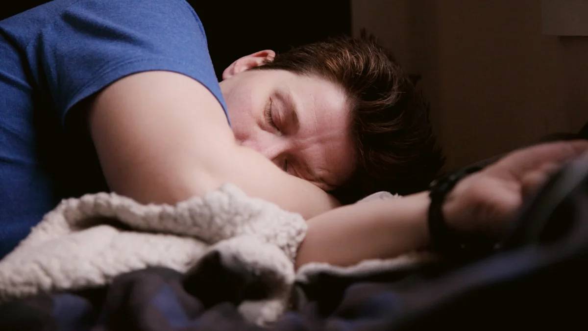 man in blue shirt sleeping — a Sleep, Finally guide to Why Teens Sleep Until Noon on Weekends